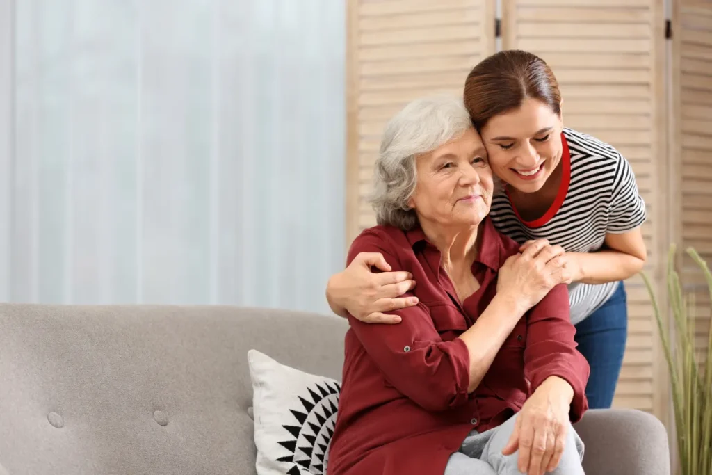 Senior woman embracing daughter