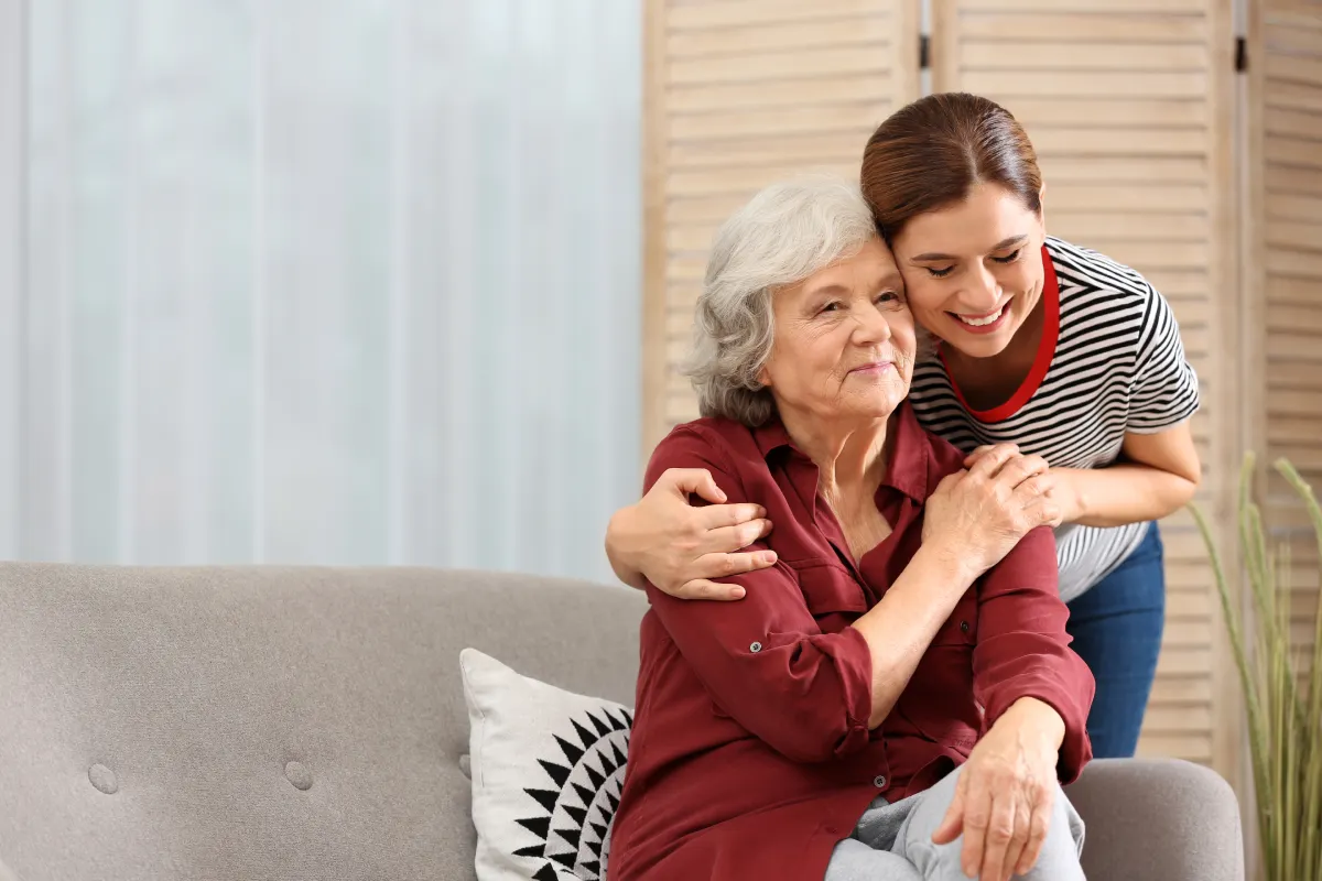 Senior woman embracing daughter